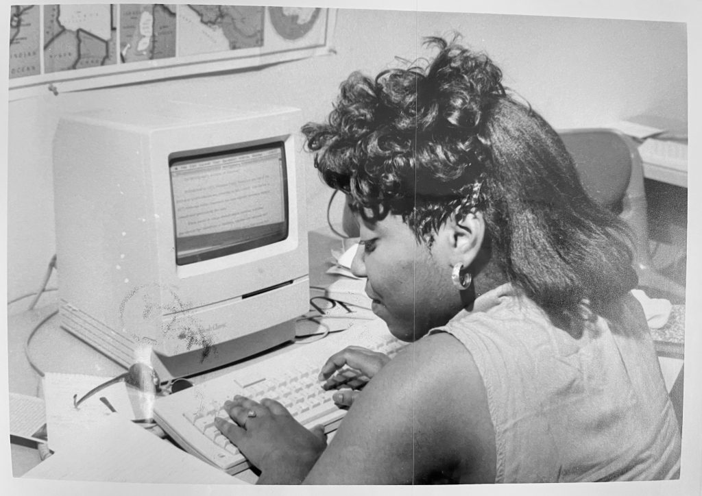 A student works at a computer during camp.
